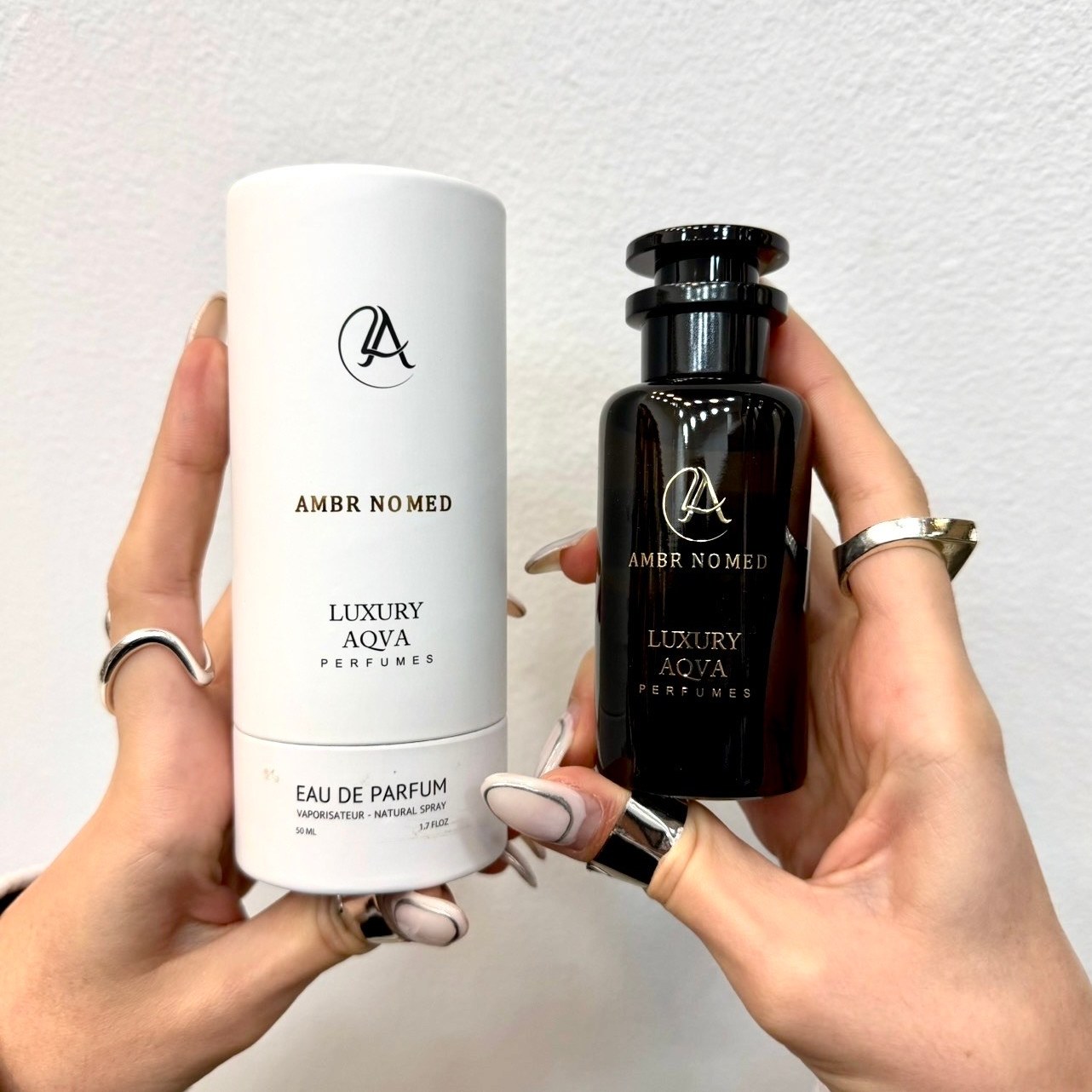 ادکلن لاکچری آکوا LUXURY AQVA مدل لویی ویتون آمبر نومد AMBR NOMED حجم 50 میلی لیتر